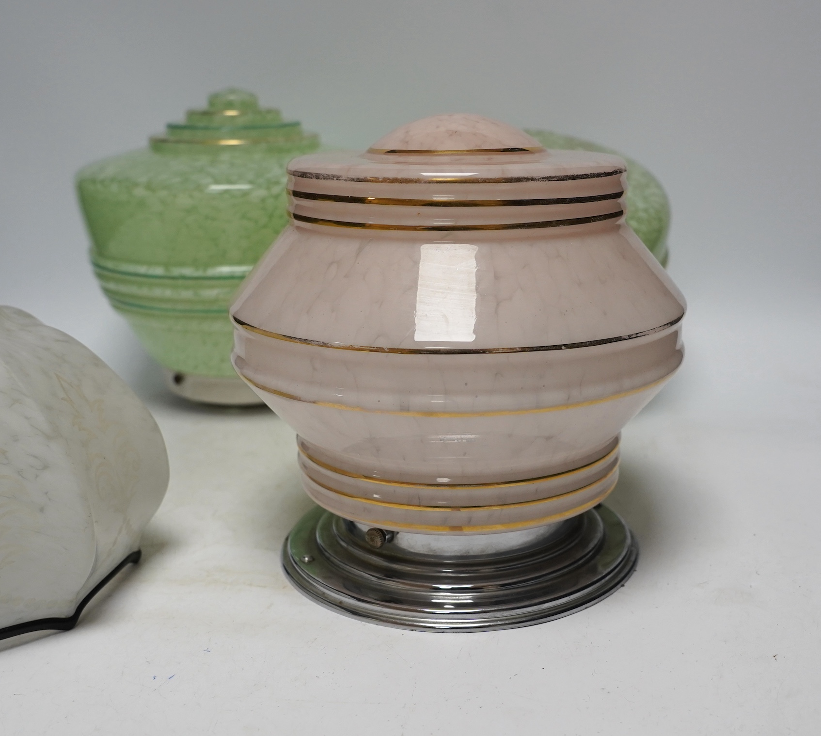 Four Art Deco glass light shades and an earlier glass shade